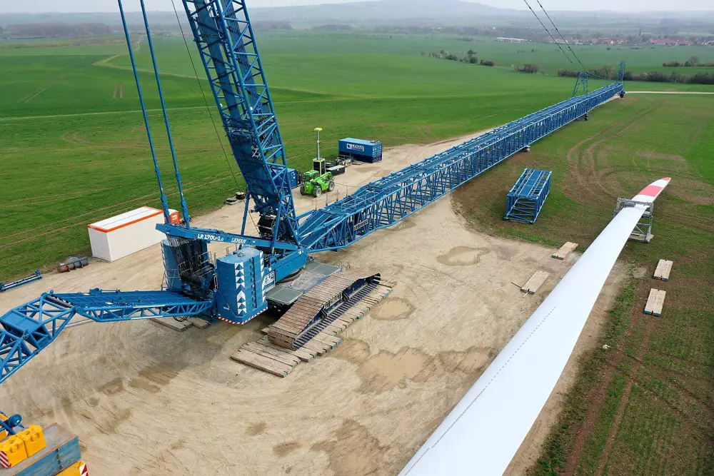 Crawler crane with a long lattice boom on a job site